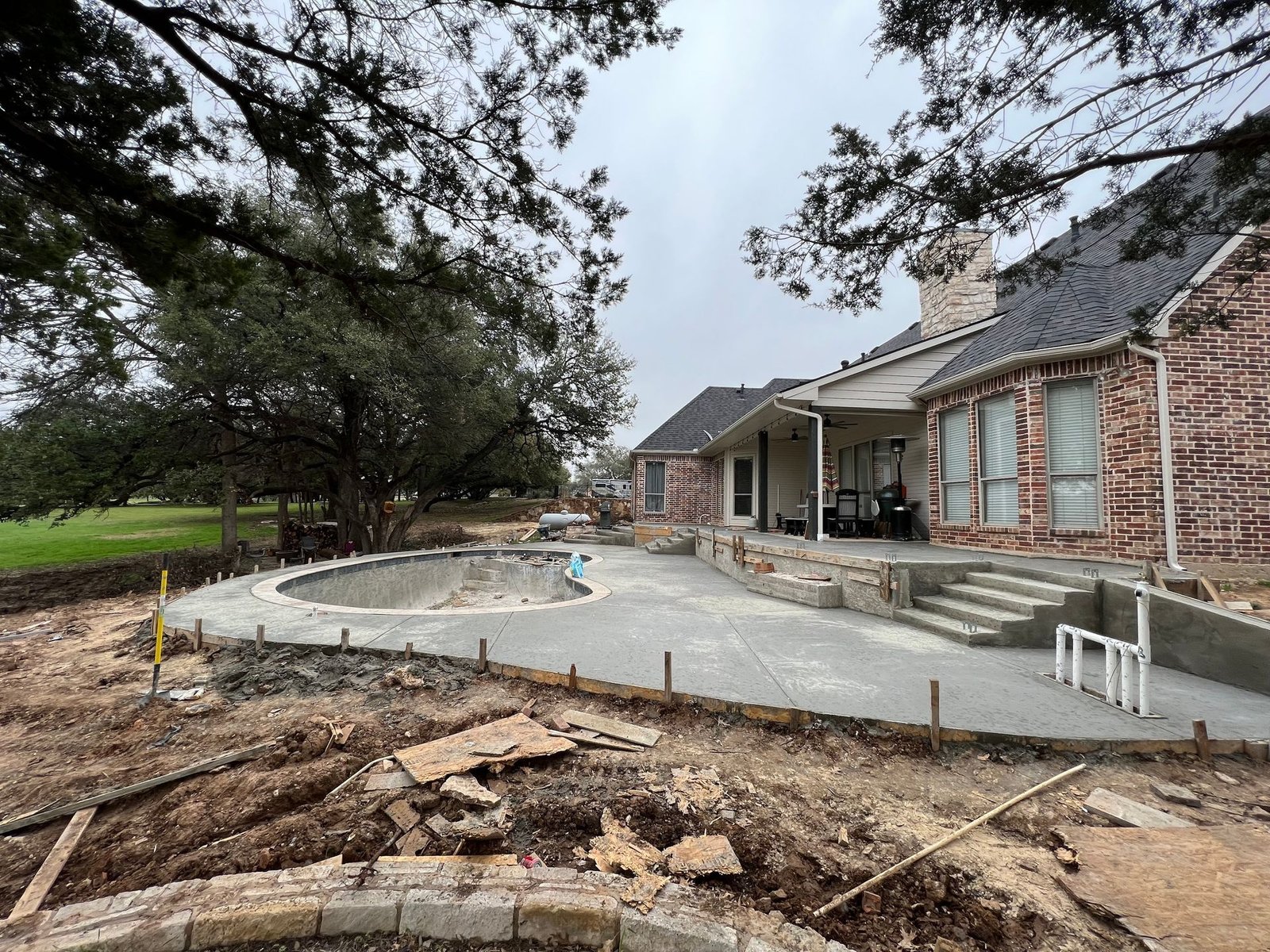 Resort-style pool with raised spa spillover — Hood County, TX